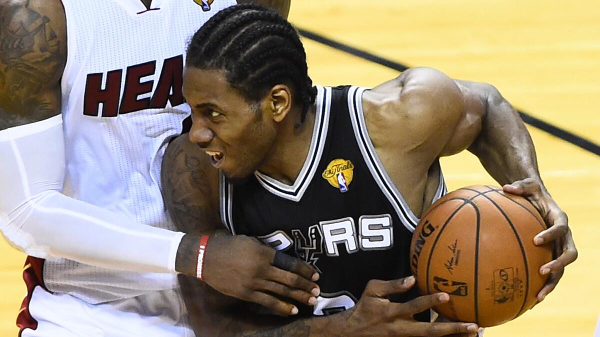 San Antonio forward Kawhi Leonard drives to the basket during the Spurs' 111-92 win in Game 3 of the NBA Finals on Tuesday. Leonard scored 29 points in the victory.