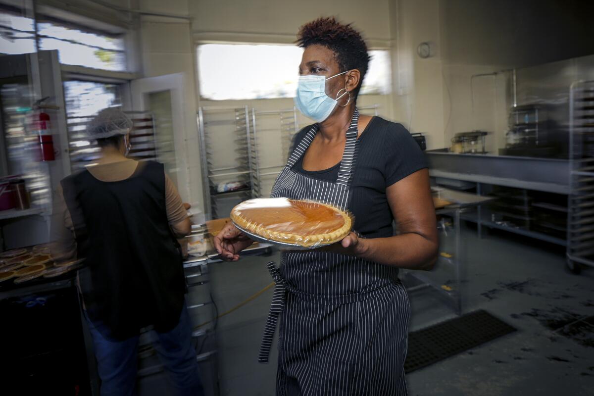  Jeanette Bolden-Pickens, owner of 27th Street Bakery Shop in South L.A., prepares pies. 