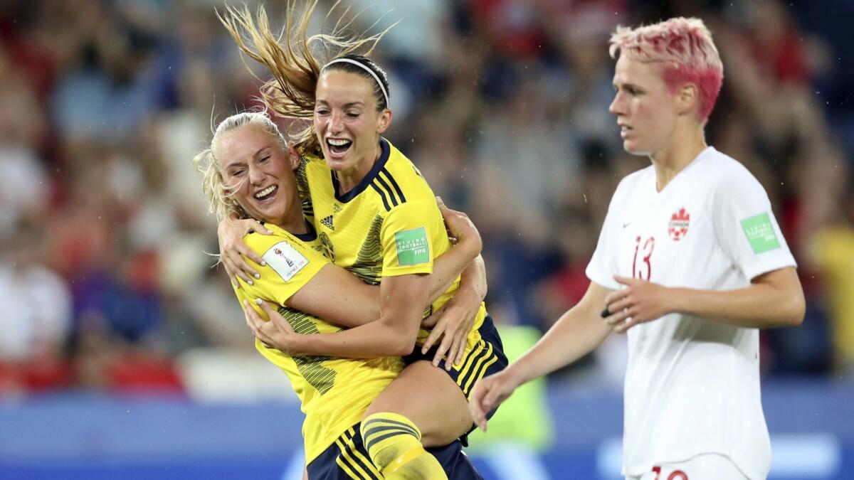 Sweden's Stina Blackstenius, left, celebrates with a teammate after scoring against Canada in a 1-0 victory at the Women's World Cup on Monday.