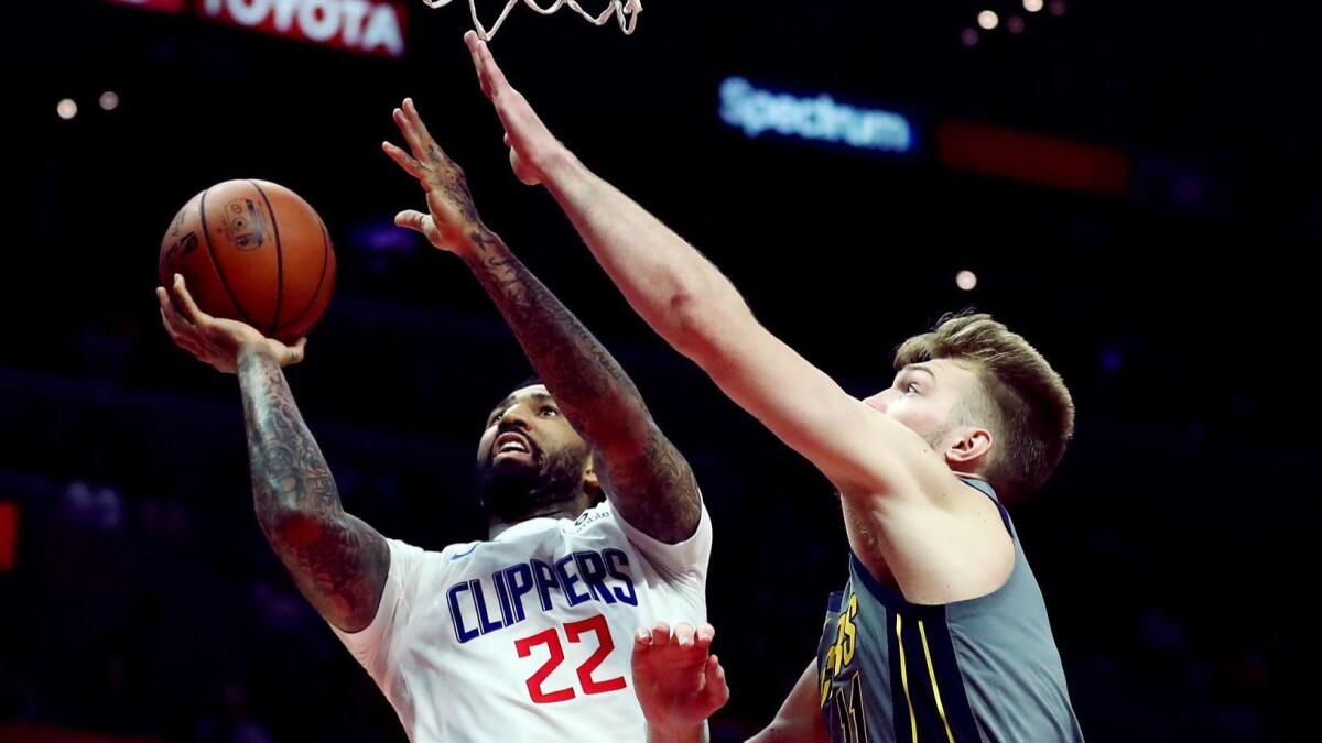 Clippers forward Wilson Chandler tries to score inside against Pacers forward Domantas Sabonis during a game March 19.