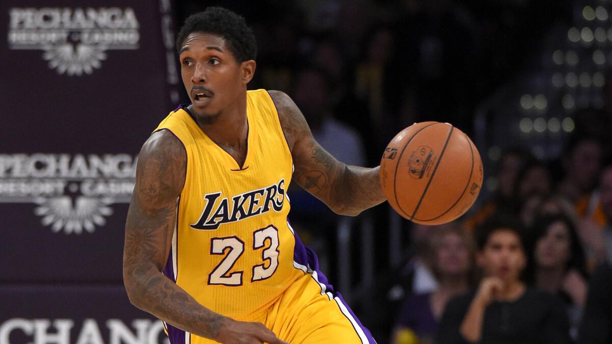 Lakers guard Lou Williams brings the ball up court during a game against the Nuggets on Nov. 3.