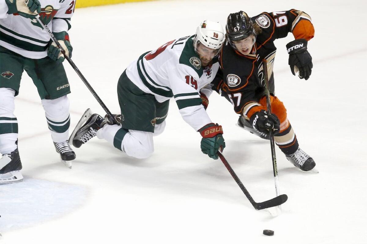 Wild forward Jarret Stoll and Ducks forward Rickard Rakell battle for control of the puck during a game on Jan. 20.