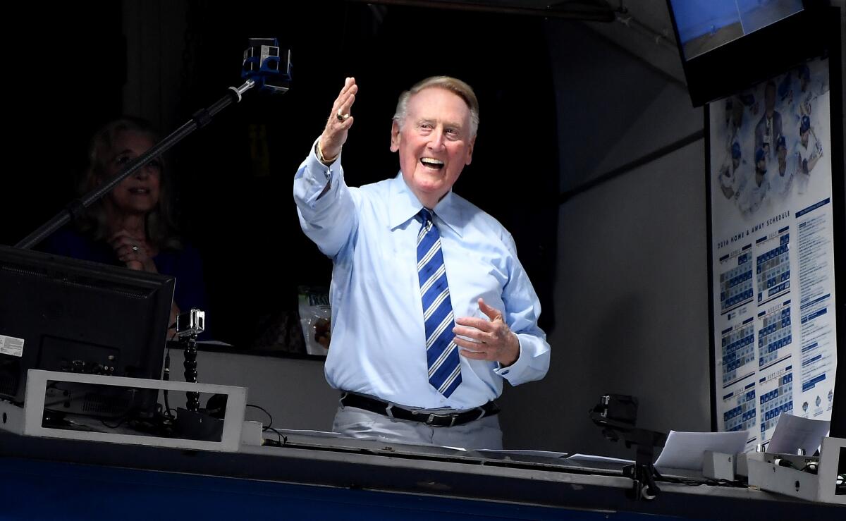 Dodgers announcer Vin Scully greets the crowd before a game against the Giants at Dodger Stadium on Sept. 20, 2016.