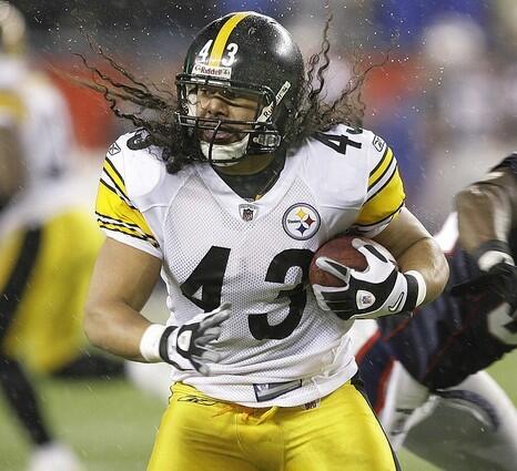 Pittsburgh Steelers safety Troy Polamalu returns the ball after intercepting a pass against the New England Patriots on Nov. 30. Polamalu was a three-year starter at USC and was selected 16th overall in the 2003 NFL draft.