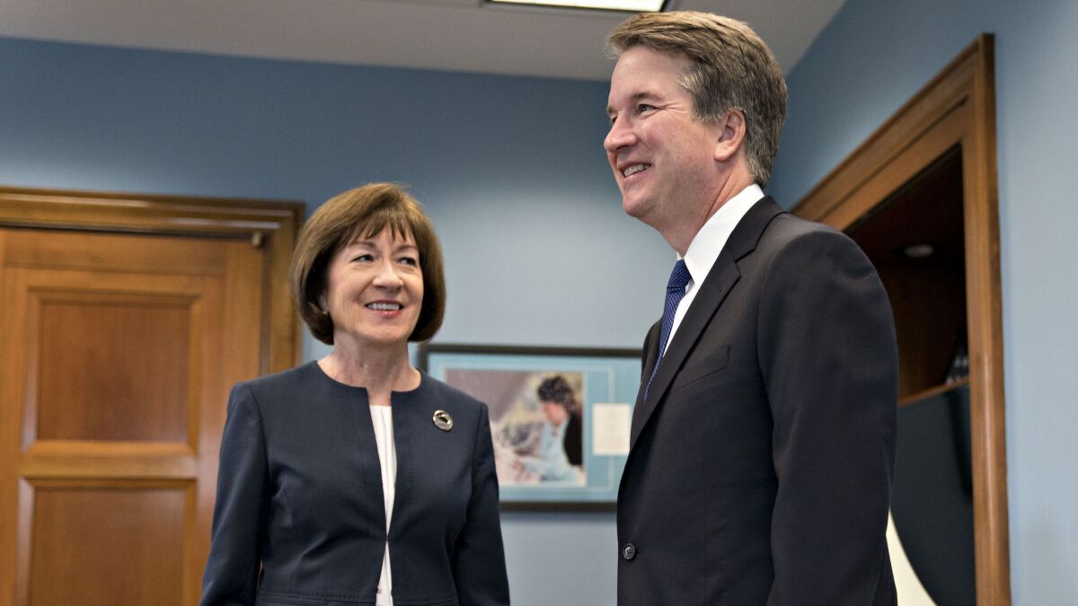 In this file photo from August of 2018, Sen. Susan Collins, R-Maine, meets Supreme Court nominee Brett Kavanaugh on Capitol Hill.