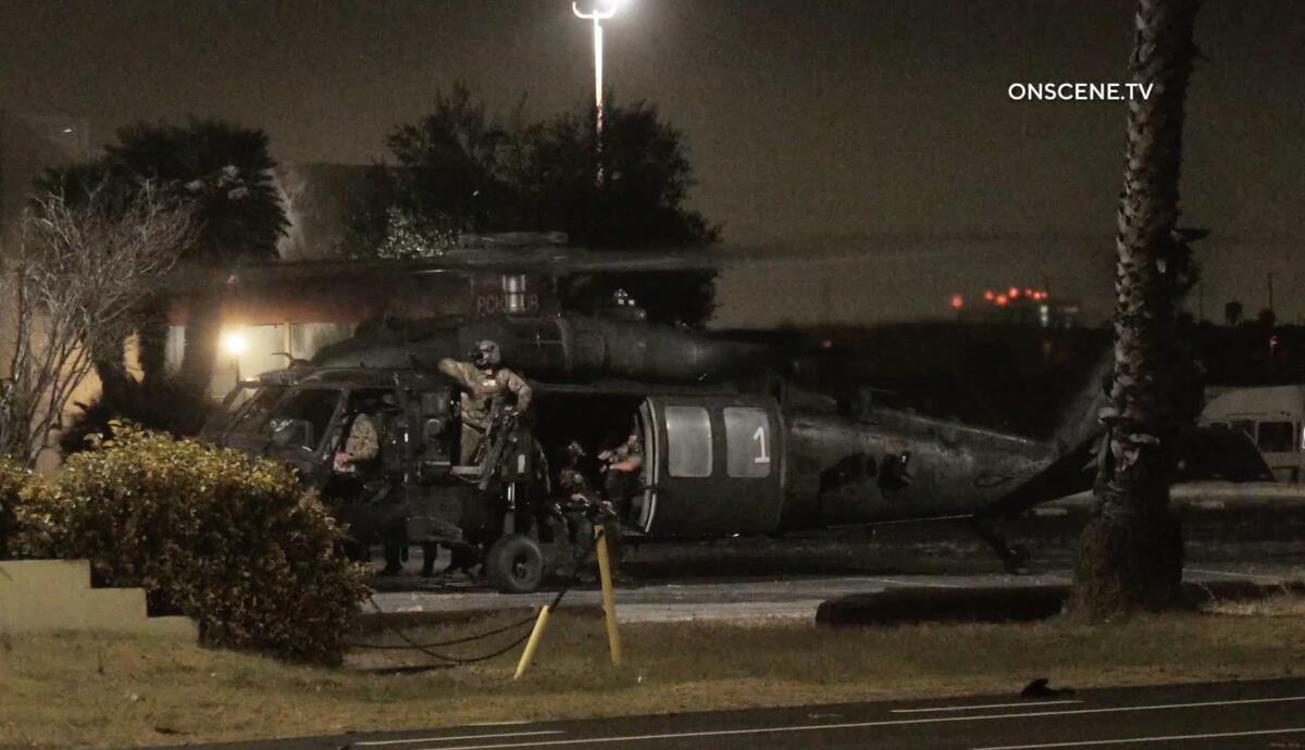 A military helicopter at night.