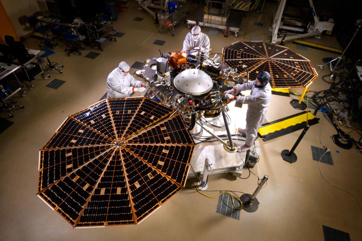 Engineers test the solar arrays on NASA's InSight Mars lander to be sure they will deploy properly when they reach the Martian surface.