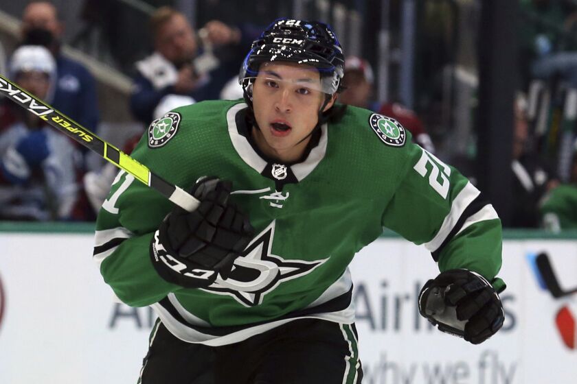 Dallas Stars left wing Jason Robertson (21) skates down the ice at an NHL preseason hockey game against the Colorado Avalanche Thursday, Oct. 7, 2021, in Dallas. (AP Photo/Richard W. Rodriguez)