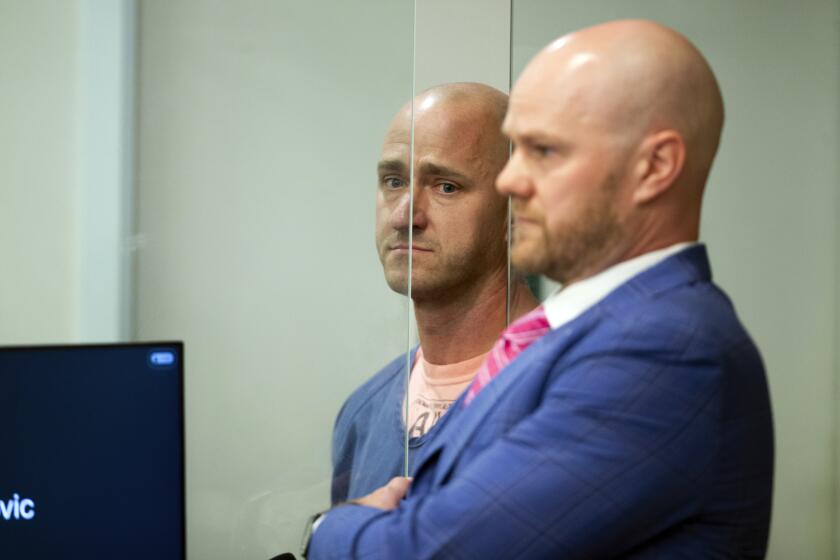 FILE - Joseph Emerson, left, is arraigned in Multnomah County Circuit Court, Oct. 24, 2023, in Portland, Ore. The former Alaska Airlines pilot accused of trying to cut the engines of a Horizon Air flight has been indicted on 83 charges of recklessly endangering another person and one charge of endangering an aircraft. However, Emerson is no longer charged with attempted murder. The district attorney in Oregon's Multnomah County, home to Portland, announced the grand jury's indictment Tuesday, Dec. 5 Emerson is scheduled to be arraigned on the indictment. (Dave Killen/The Oregonian via AP, Pool, File)