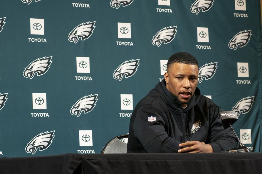 Philadelphia Eagle's Saquon Barkley talks to the media during a press conference after signing with the NFL football team, Thursday, March 14, 2024, in Philadelphia. (AP Photo/Chris Szagola)