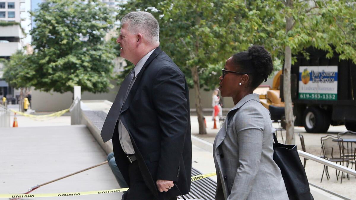 Rear Adm. Robert Gilbeau enters the Federal Courthouse where he pleaded guilty to lying to a federal investigator in the 'Fat Leonard' Navy bribery trial.