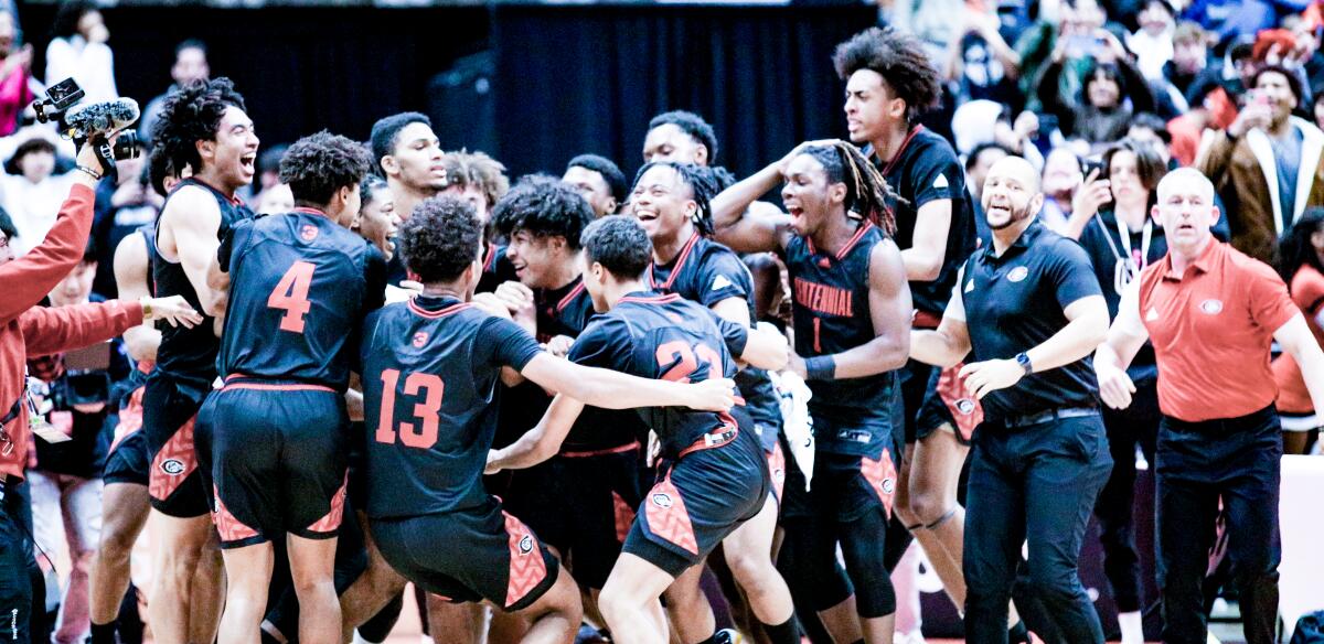 Corona Centennial players and coaches celebrate 