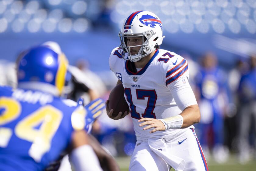 Buffalo Bills quarterback Josh Allen (17) runs with the ball against the Los Angeles Rams during the second quarter of an NFL football game, Sunday, Sept. 27, 2020, in Orchard Park, N.Y. (AP Photo/Brett Carlsen)
