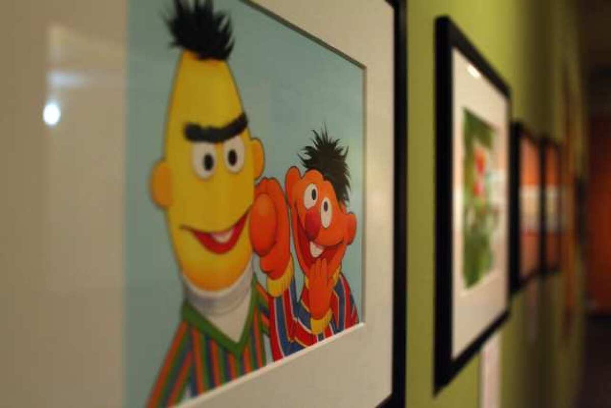 File art: An image of Bert and Ernie hangs on display at an exhibit at the Los Angeles Central Library.
