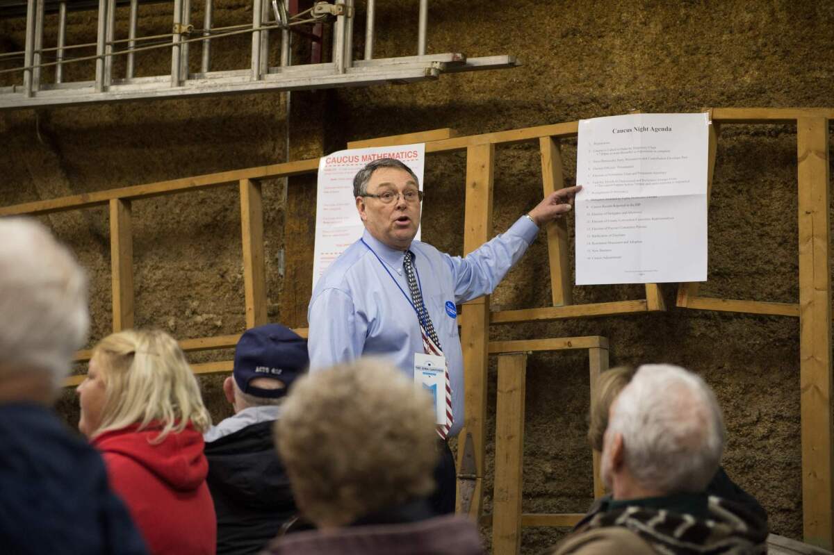 Caucus chairman Mike Short speaks to Democratic caucus-goers Monday night in Keokuk, Iowa.