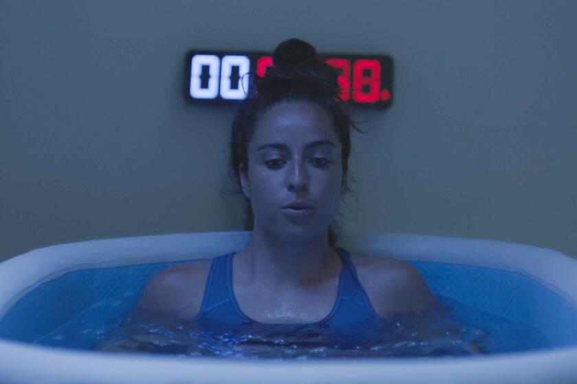 Soccer star Natalie Higgins hits the cold tank as part of her road to recovery from a sidelining knee injury.