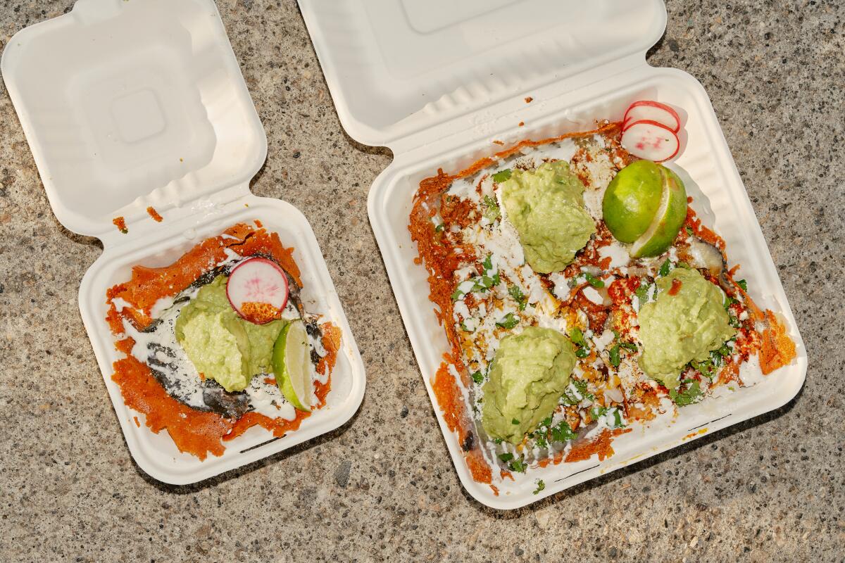 An overhead photo of three tacos and a mulita in white to-go containers