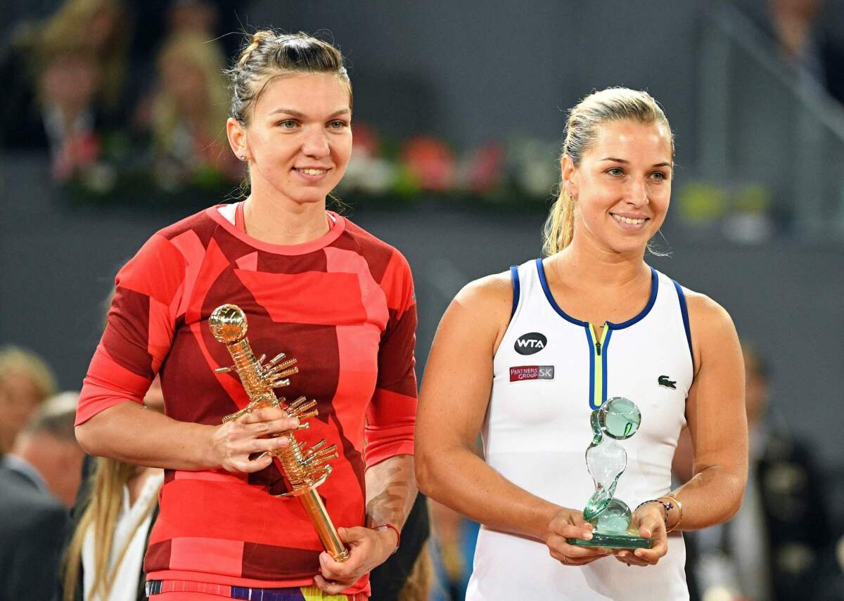 Simona Halep, left, defeated Dominika Cibulkova in the women's singles final at the Madrid Open on Saturday.