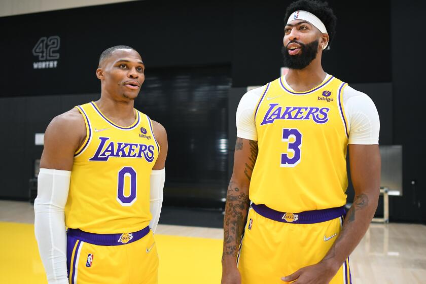 El Segundo, CA. September 28, 2021: Lakers Russell Westbrook, left,and Anthony Davis chat during media day at the UCLA Health Training Center in El Segundo Tuesday. (Wally Skalij/Los Angeles Times)