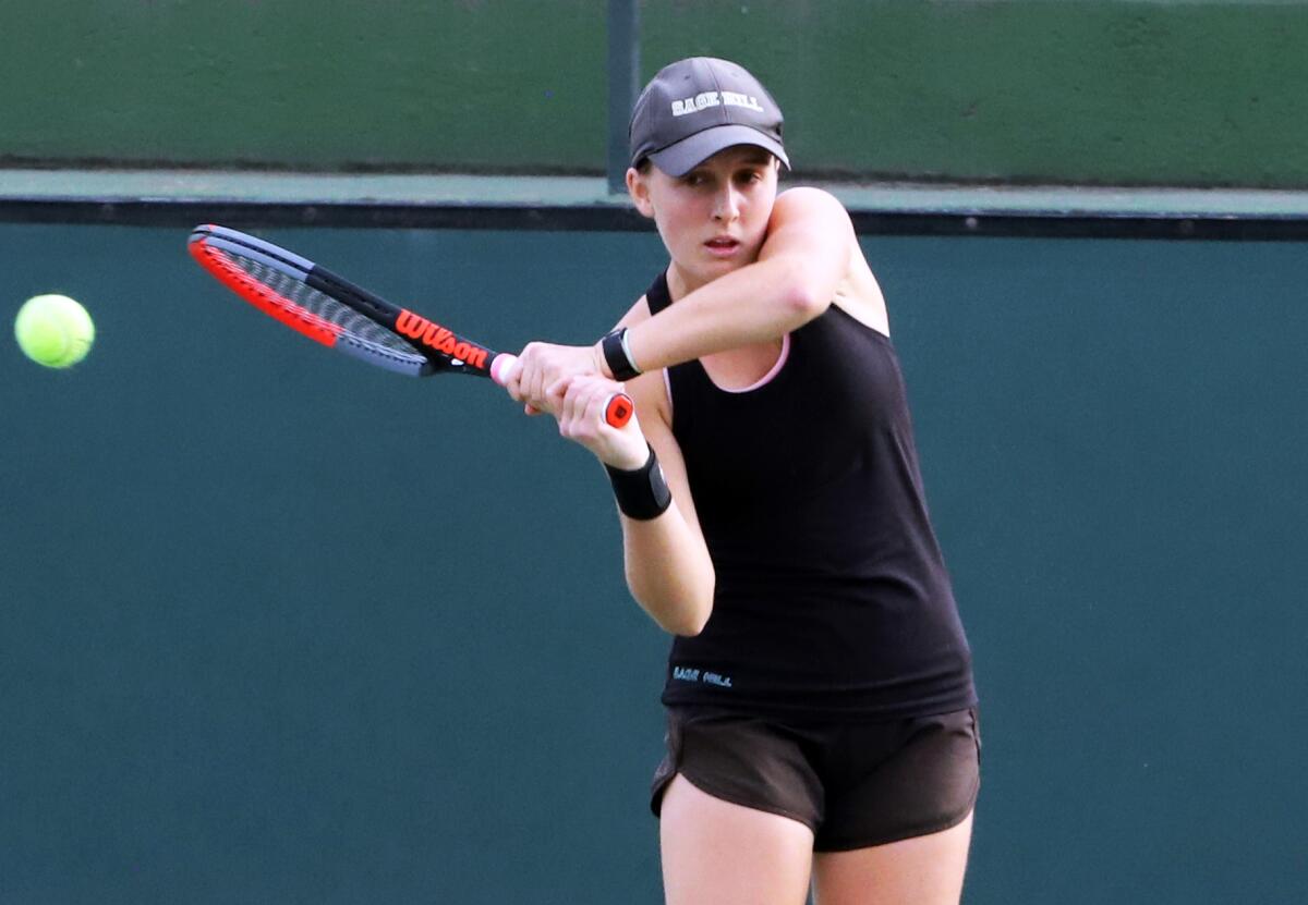 Sage Hill's Arden Stobart returns with a backhand in a  girls' tennis final against Northwood on Friday.