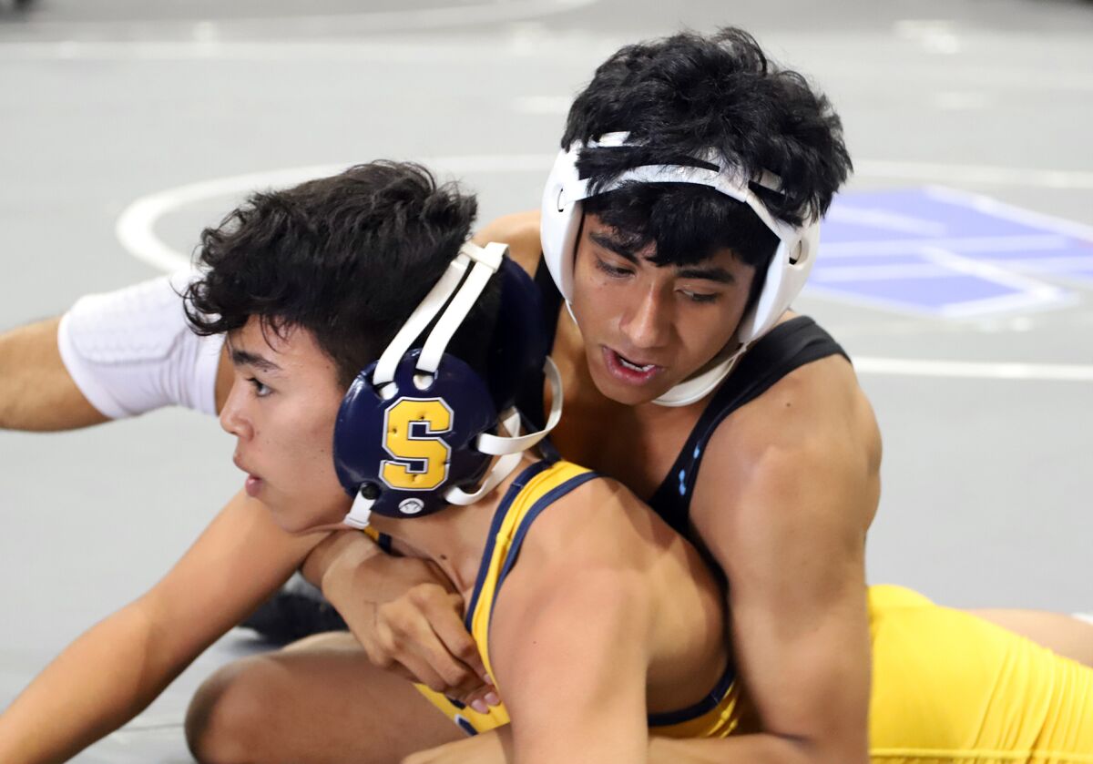 Marina's Haden Hernandez against Channel Islands in the 132-pound match in the CIF dual meet wrestling championships.