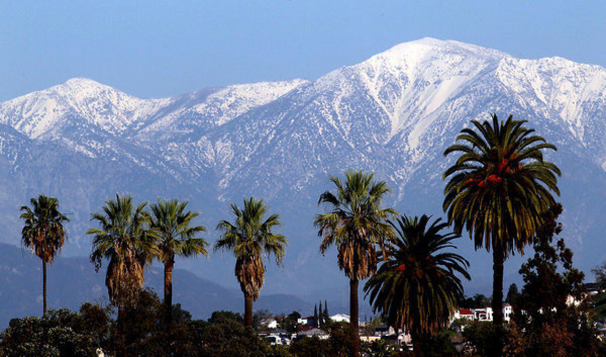Snow dusts the San Gabriel Mountains. Climate change could dramatically reduce the amount of snow that falls on Southern California mountains, making scenes like this rarer.