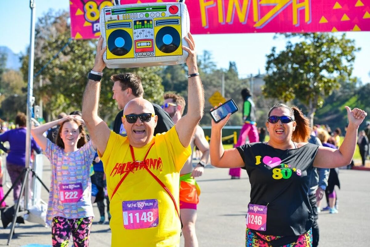 People run through the finish line.