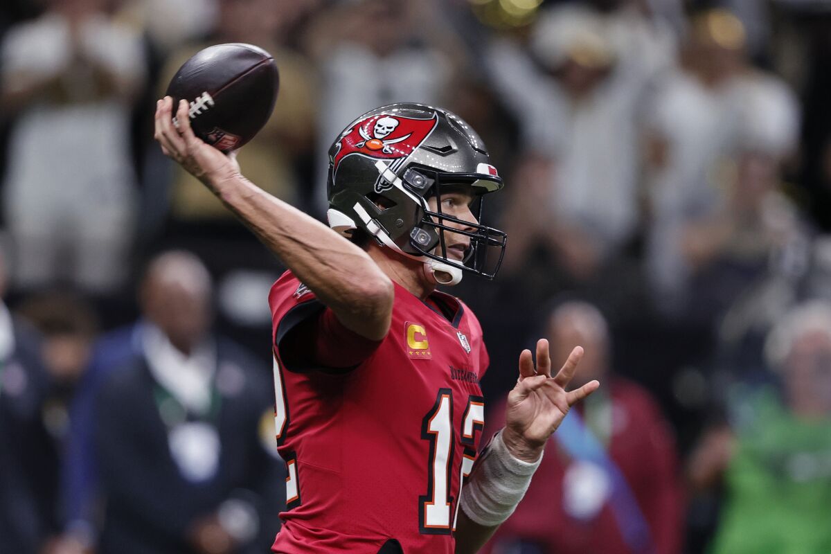 Tampa Bay Buccaneers quarterback Tom Brady (12) passes in the second half of an NFL football game against the New Orleans Saints in New Orleans, Sunday, Oct. 31, 2021. (AP Photo/Butch Dill)