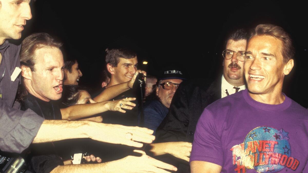 Fans greet Arnold Schwarzenegger as he arrives at the Forum Shops in July 1994. (Las Vegas News Bureau)