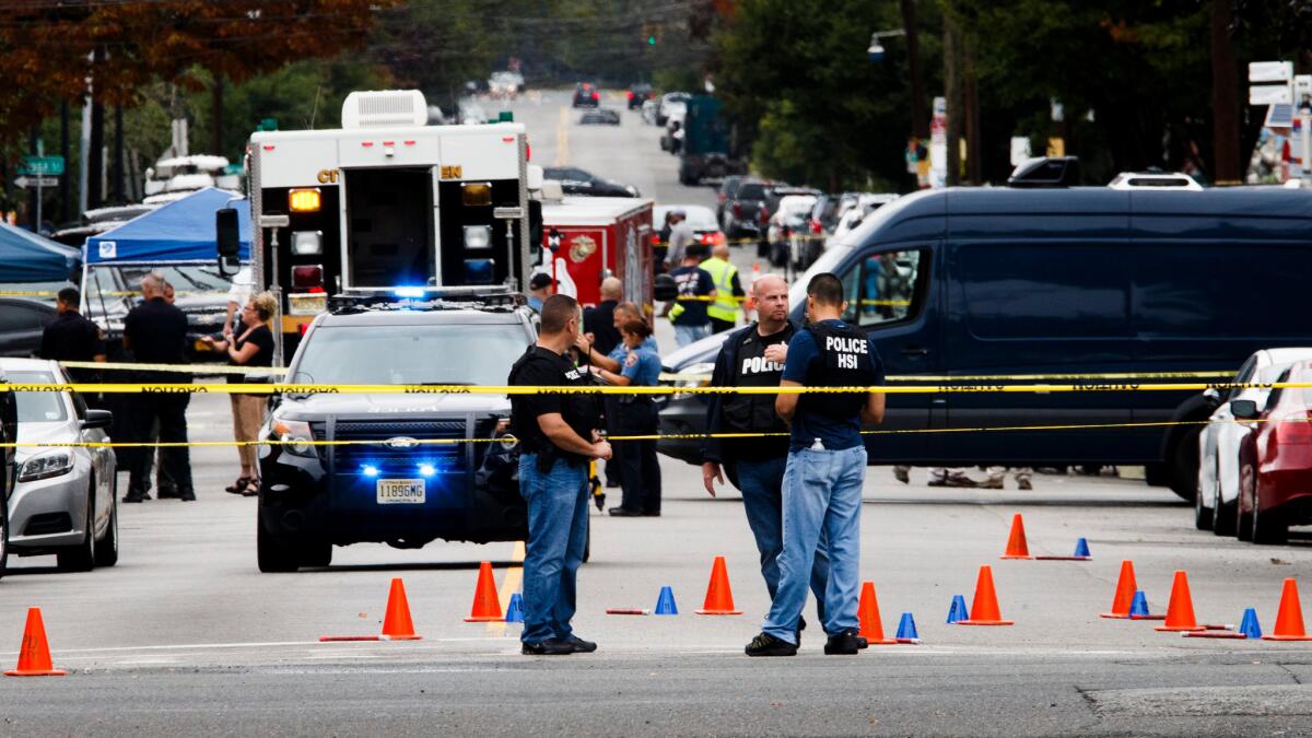 Police work at the scene where Ahmad Khan Rahami, the suspect in the Sept. 17 explosion in New York City and a second bombing later that evening in New Jersey, was arrested following a shootout with police in Linden, New Jersey on Sept. 19.