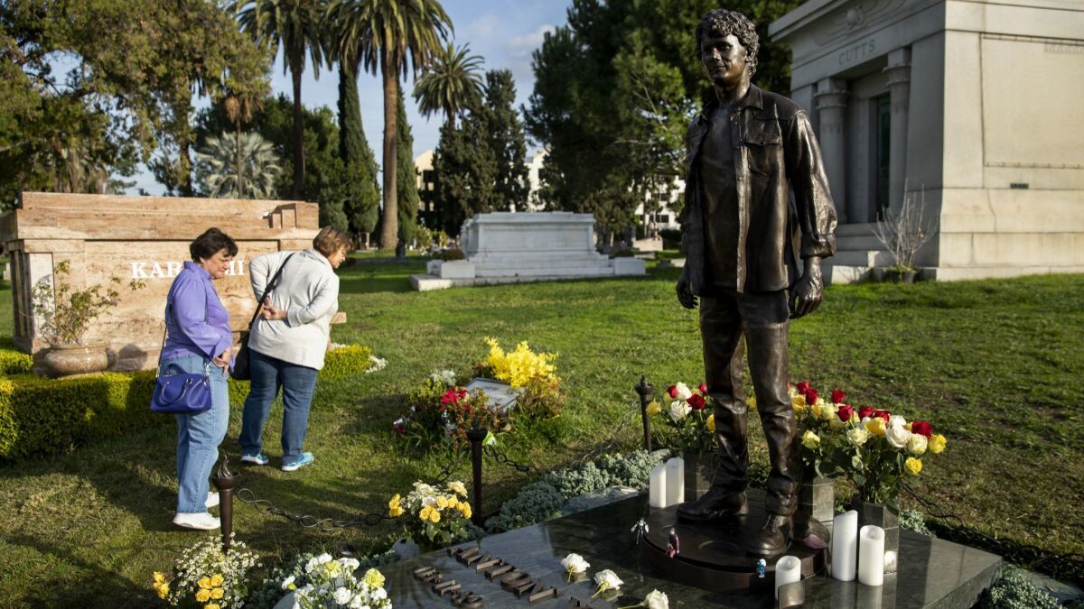 A statue of Anton Yelchin was erected above his grave at Hollywood Forever cemetery by his parents.