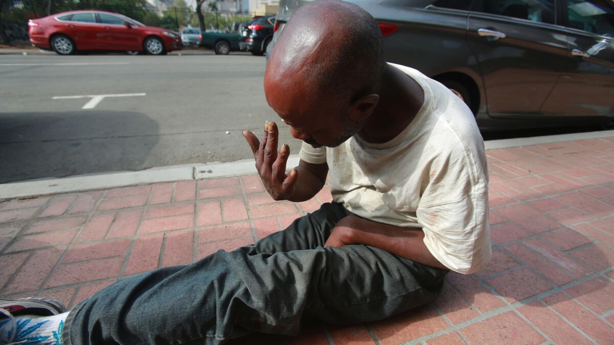 In this 2016 file photo, Waddell Robinson, 50, was waking up on a downtown sidewalk. Robinson, who said he was diagnosed with schizophrenia and heard constant voices, had repeatedly had all his possessions stolen, leaving him without identification or a jacket.