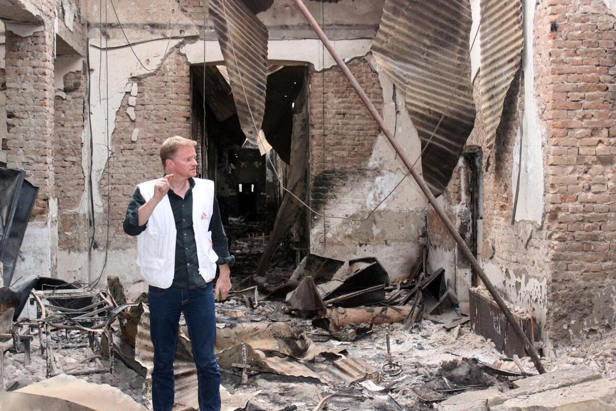 Christopher Stokes, general director of Doctors Without Borders, examines the charred remains of the organization's Kunduz hospital after it was hit by a U.S. airstrike.