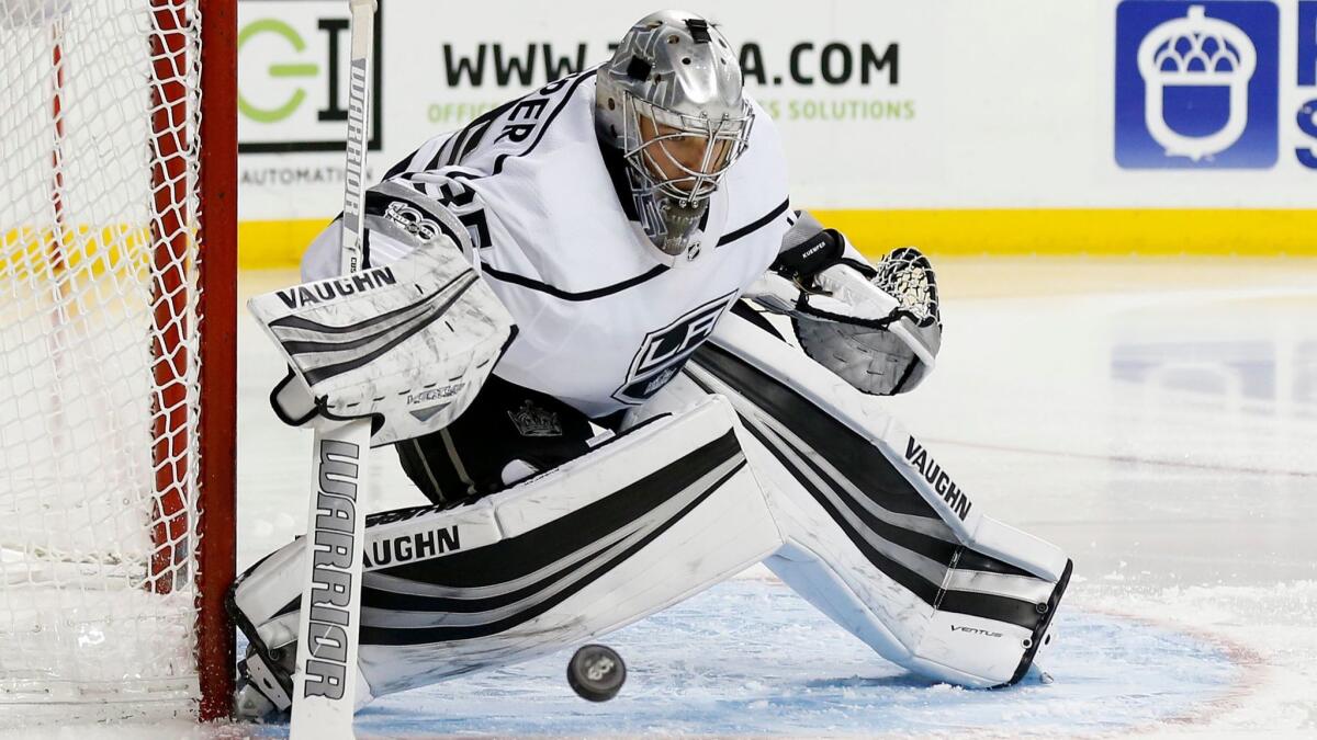 Los Angeles Kings goalie Darcy Kuemper is shown making a save against the New York Islanders on Dec. 16, which is the last time he played.
