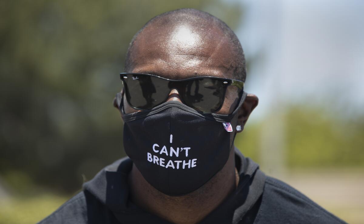 Retired NFL wide receiver Terrell Owens leads a protest.