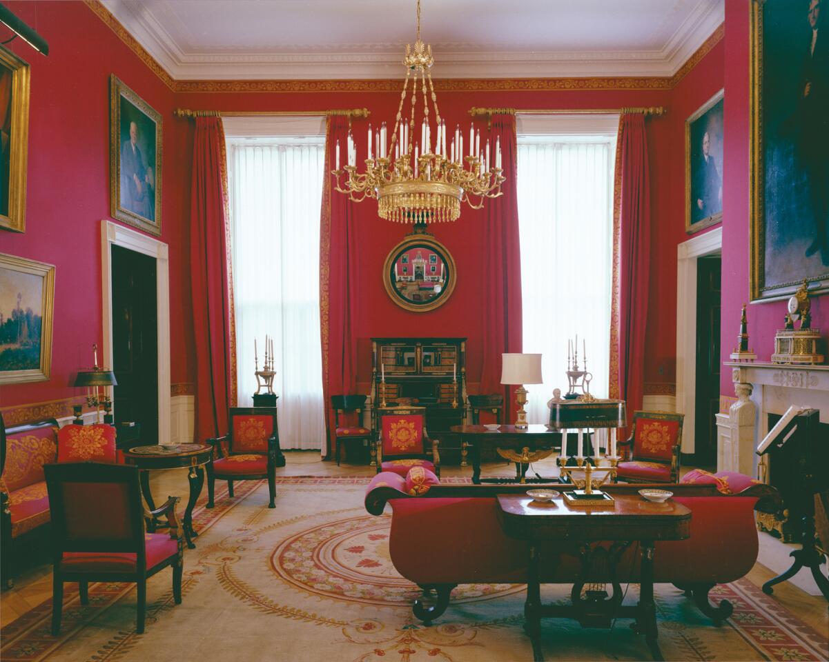 The White House Red Room, where all of the fabrics, wall coverings and trims are by Scalamandre. For the iconic Annie Leibovitz portrait of Michelle Obama in the room, you'll have to buy Stolman's book.