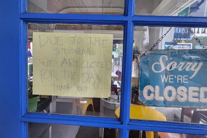 A hand-written note tells the public that the Greeter's Corner Restaurant is closed on Sunday due to Tropical Storm Hilary.