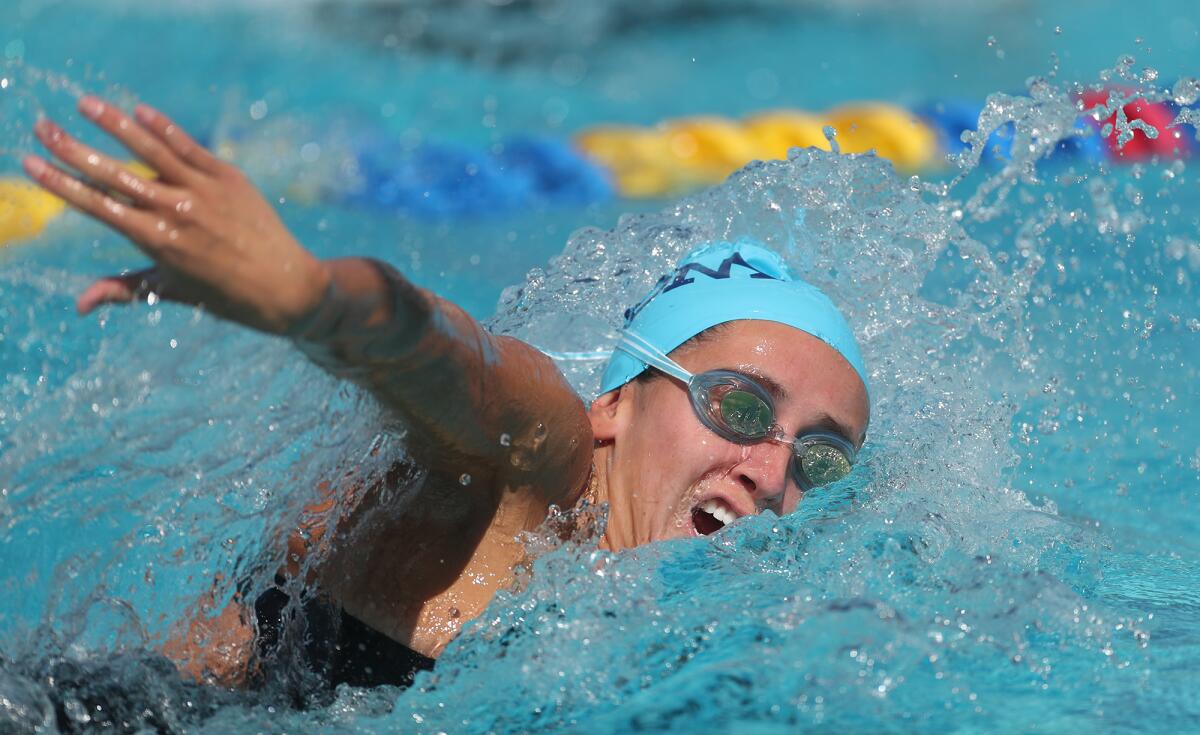 CdM's Jillian Schlom swims the freestyle during a relay at the CIF swim finals Friday. 