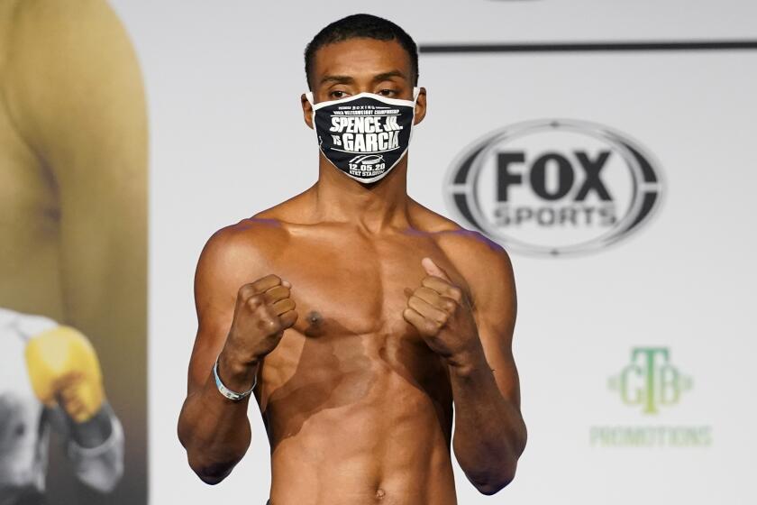 Boxer Errol Spence Jr., poses as he weighs in for a title match against Danny Garcia.