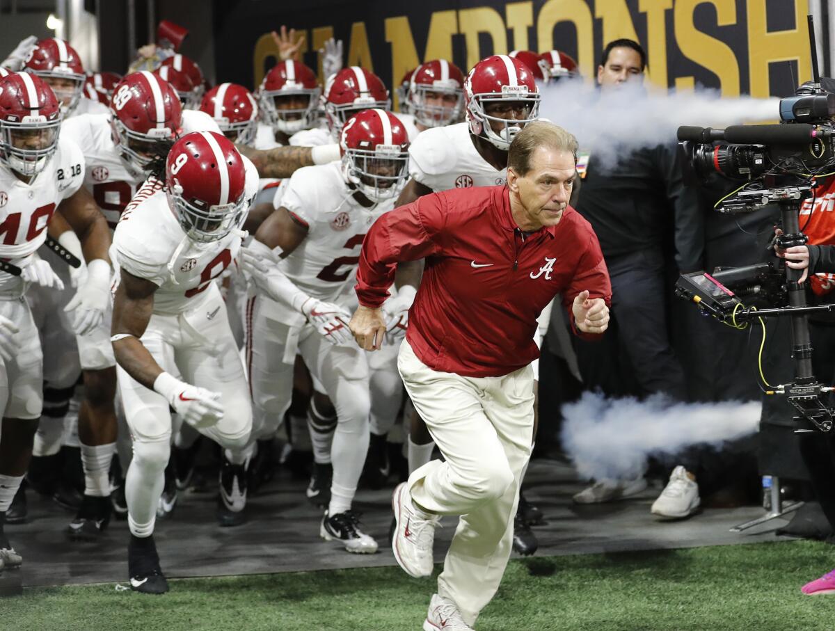 Alabama coach Nick Saban leads his team onto the field before the College Football Playoff championship game against Georgia in Atlanta on Jan. 8. Alabama beat Georgia 26-23 in overtime.