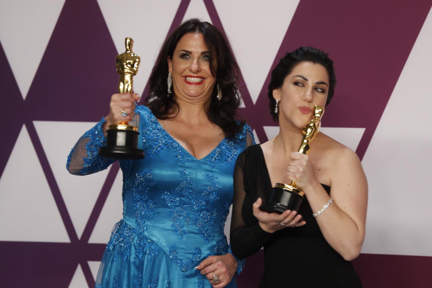 Melissa Berton, left, and Rayka Zehtabchi, winners of the live action short film award for "Period. End of Sentence."