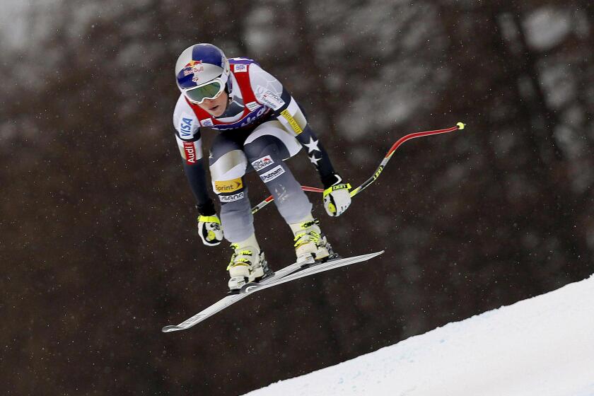 Lindsey Vonn speeds down the course at the women's World Cup downhill event Jan. 16 in Cortina d'Ampezzo, Italy.