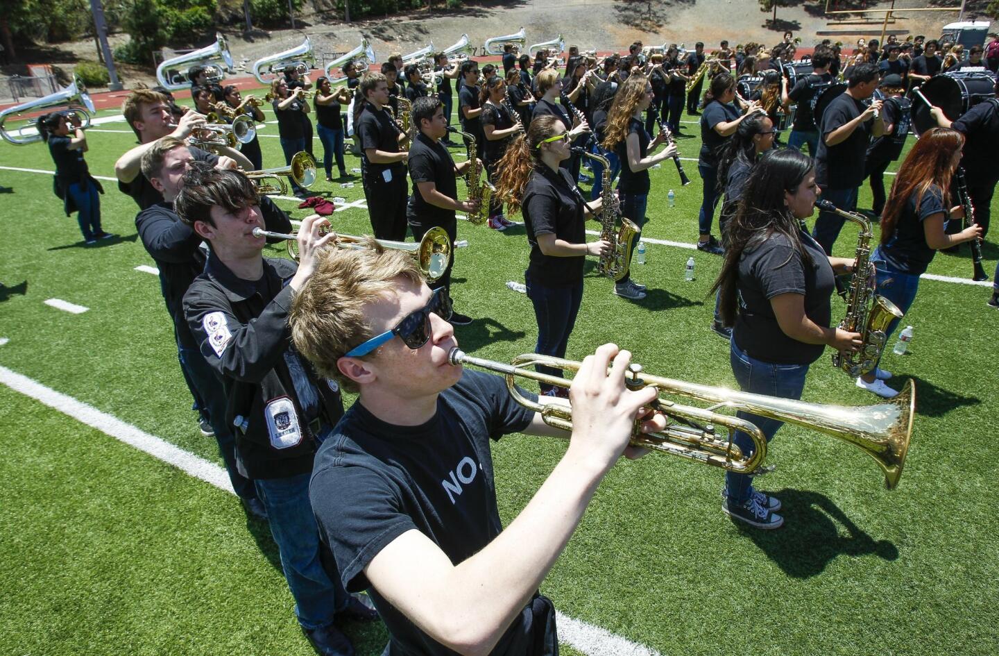 Michael McGarity and other members of the Rhythm of the Ranch Marching Band perform.