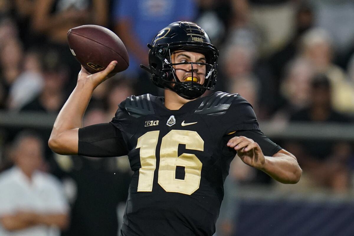 Purdue quarterback Aidan O'Connell (16) throws a pass against Penn State during the first half of an NCAA college football game in West Lafayette, Ind., Thursday, Sept. 1, 2022. (AP Photo/Michael Conroy)