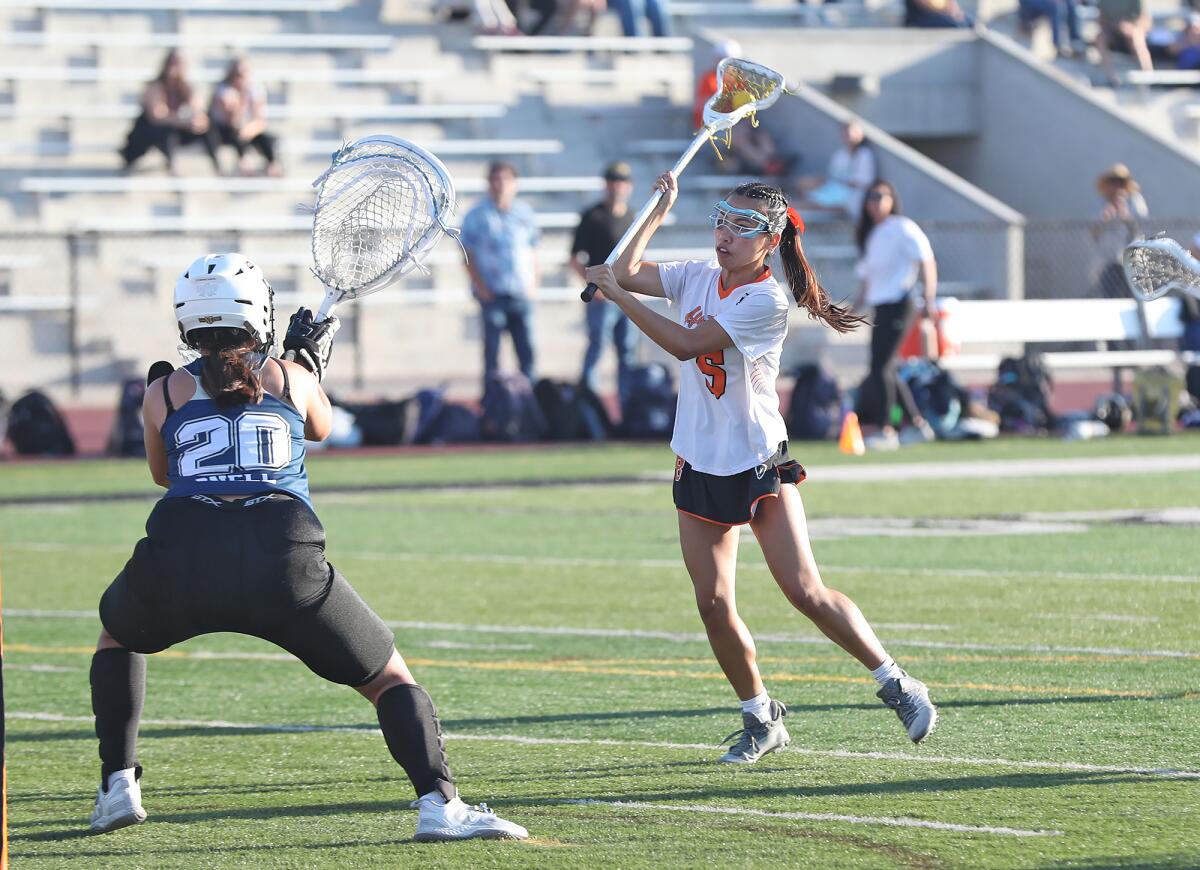 Elle Tran (5) of Huntington Beach shoots and scores after a fast break against El Segundo on Friday.