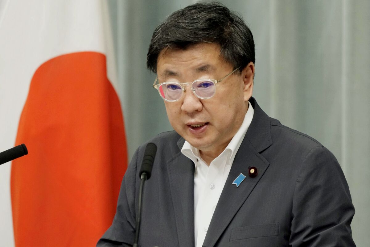 FILE - Japanese Cabinet Secretary Hirokazu Matsuno speaks during a press conference at the prime minister's office in Tokyo, Monday, May 30, 2022. Japan on Friday, May 26, 2023, approved additional sanctions against Russia over its war on Ukraine, including freezing the assets of dozens of individuals and groups and banning exports to Russian military-related organizations. (Kyodo News via AP, File)