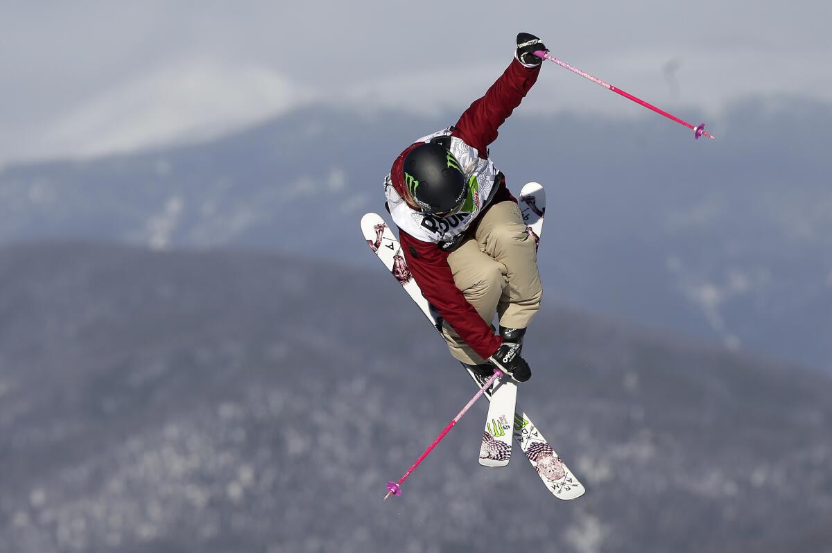 Maggie Voisin flies off a jump on her first run during a slopestyle freestyle skiing competition in Breckenridge, Colo.