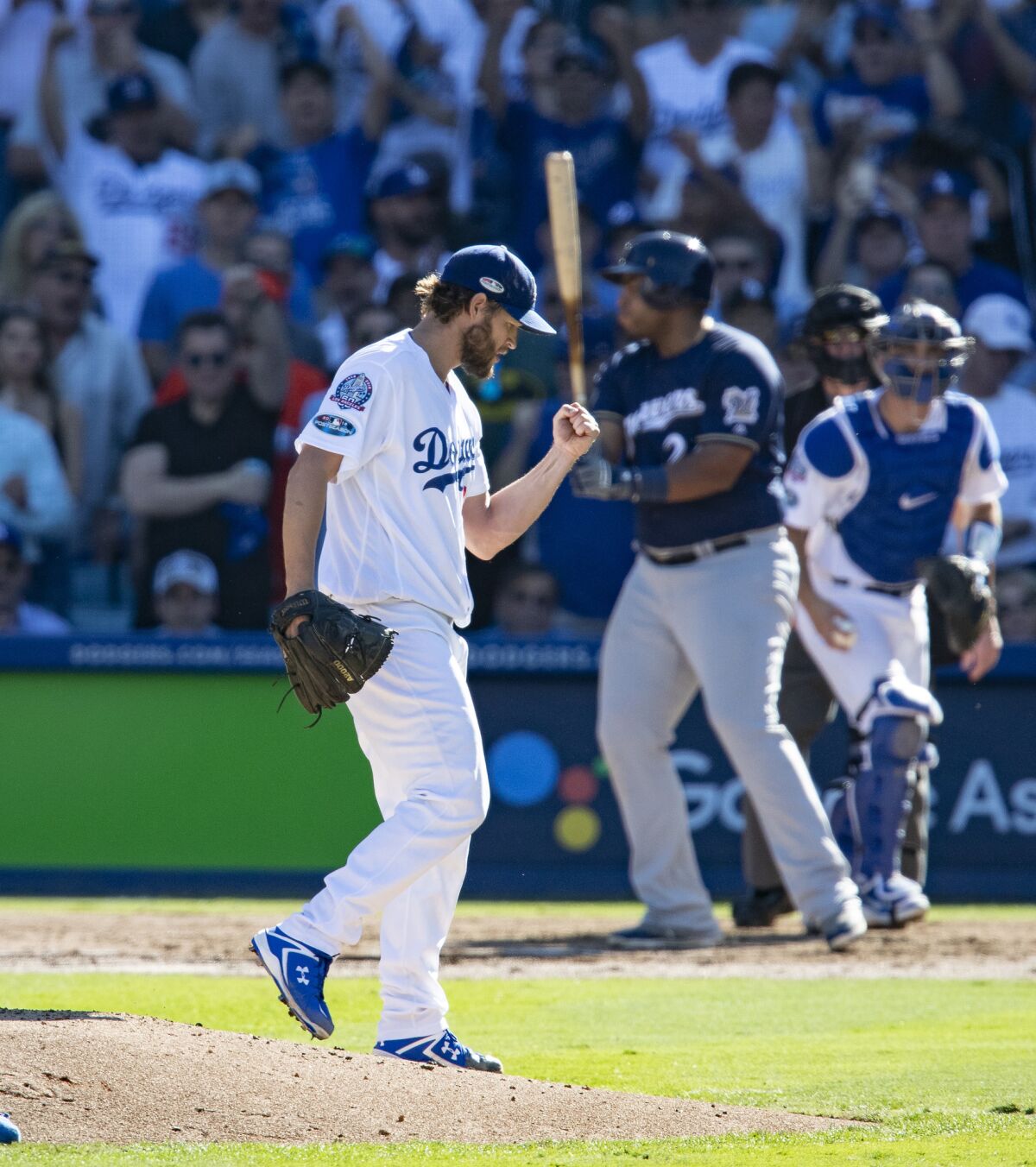 Dodgers starting pitcher Clayton Kershaw reacts after striking out Milwaukee's Jesus Aguilar with the bases loaded in Game 5 of the NLCS.