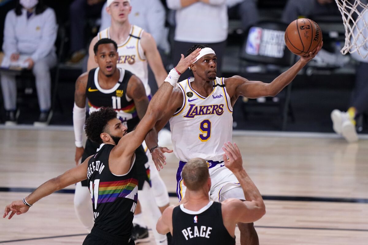 Lakers guard Rajon Rondo scores on a layup against the Nuggets during Game 3 on Sept. 22, 2020.