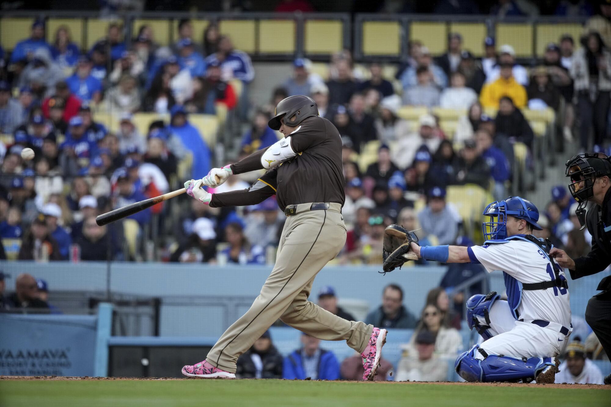 Manny Machado hits a home run during a baseball game against the Dodgers